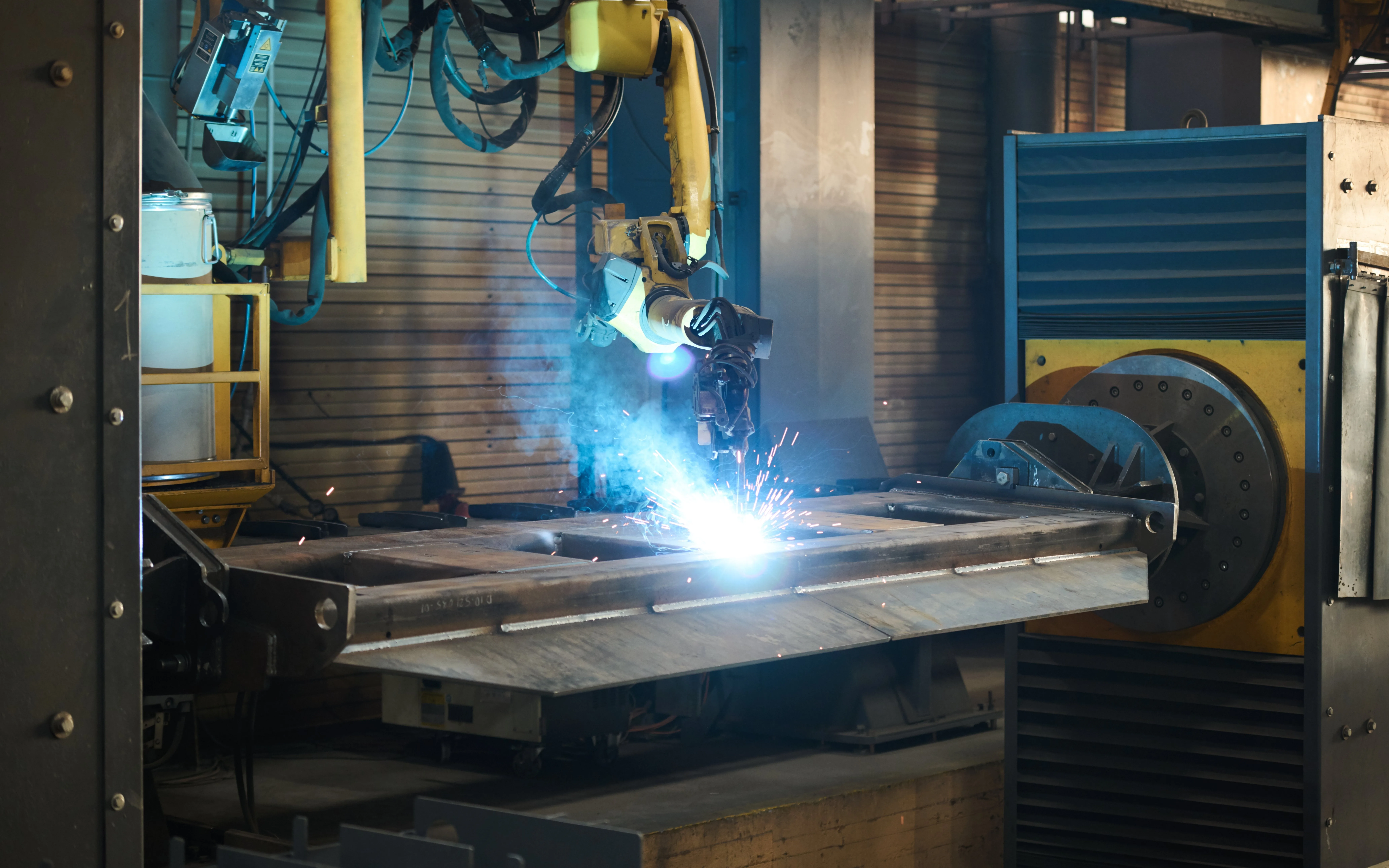 Industrial robot arms on a production line
